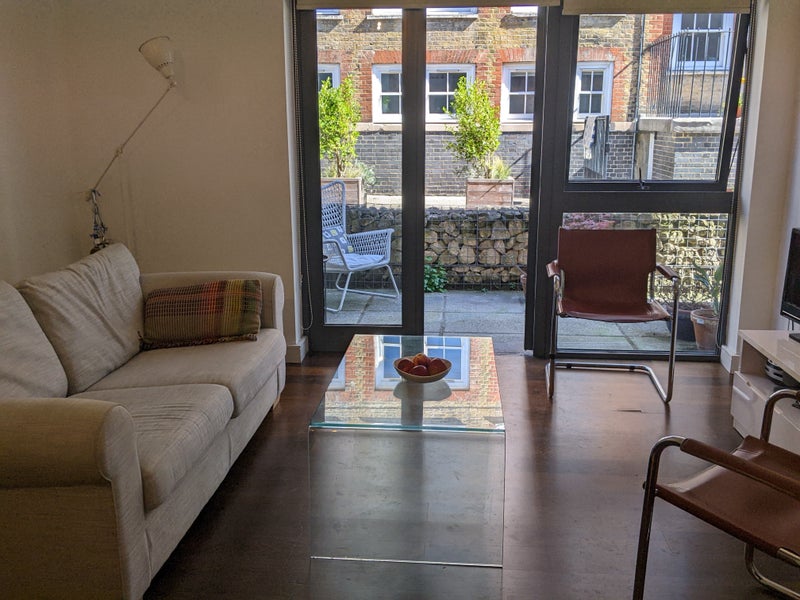 Photo 1: Living room and doors to patio
