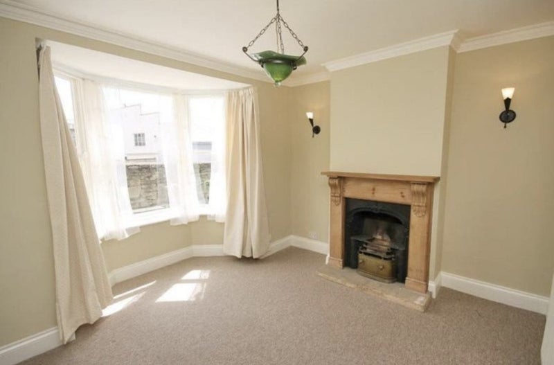 Photo 1: Our living room (it is now white and furnished)