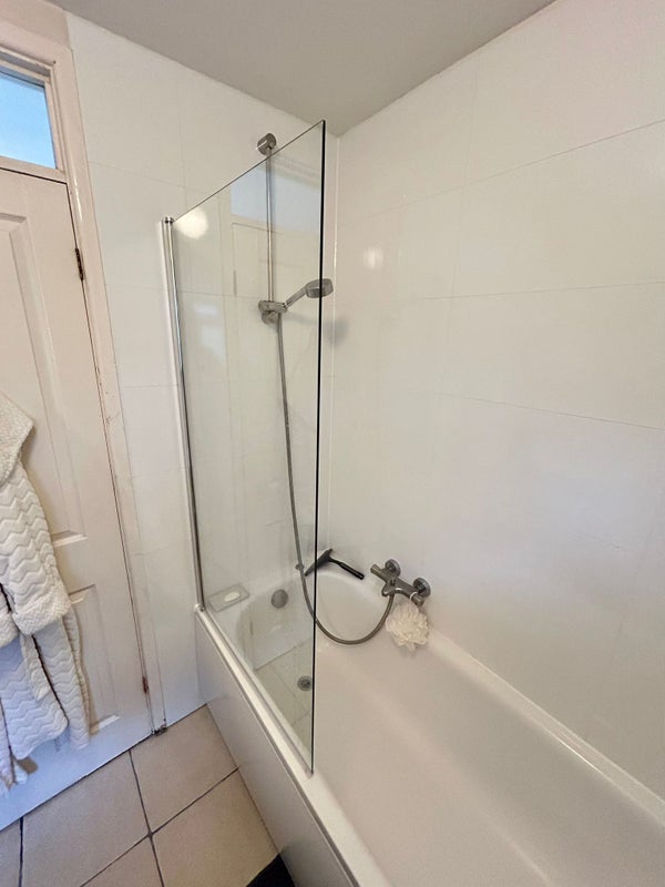 Photo 1: shower over bath and newly tiled