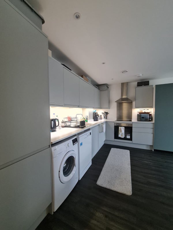 Photo 1: shared kitchen/ living room