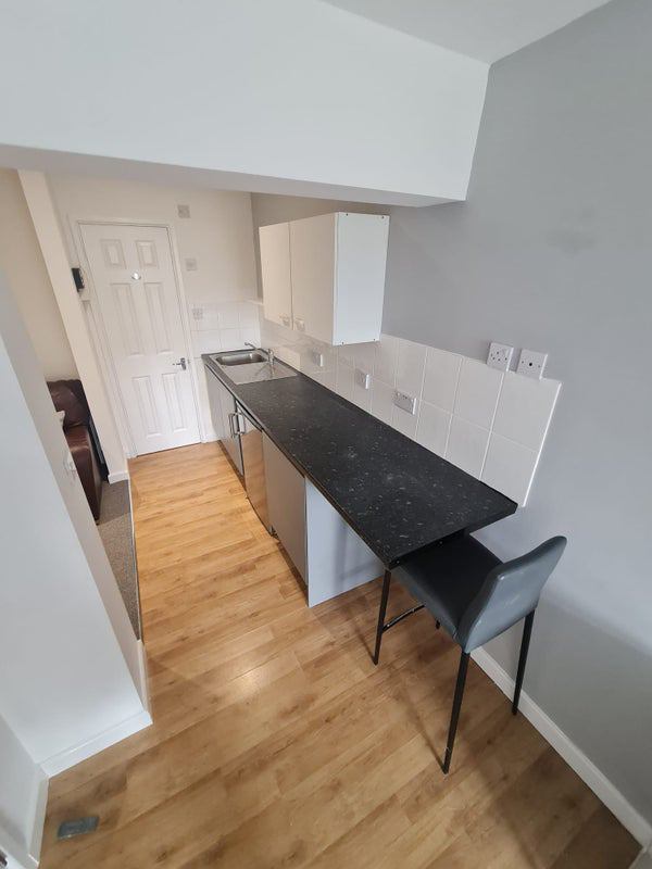 Photo 1: Includes Kitchenette & Breakfast bar (includes appliances)