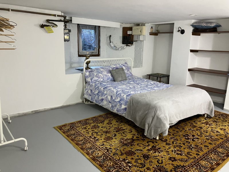 Photo 1: large basement room and double bed 