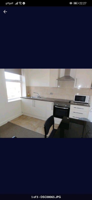 Photo 1: There is a new, wooden desk with more storage currently, and a new sofa.