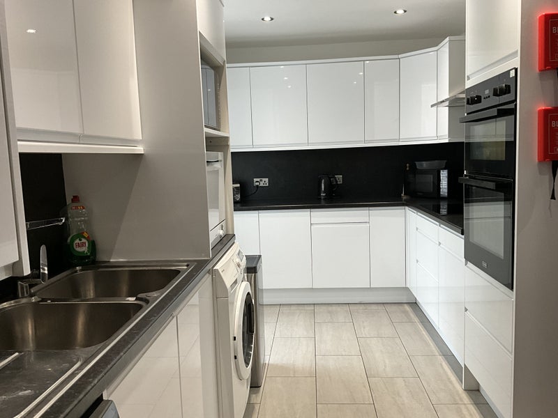 Photo 1: Large L shape kitchen