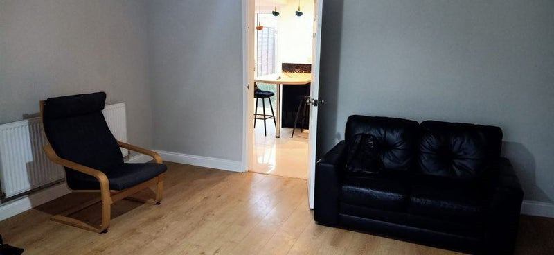 Photo 1: One side of the very spacious living room leading to the super spacious kitchen