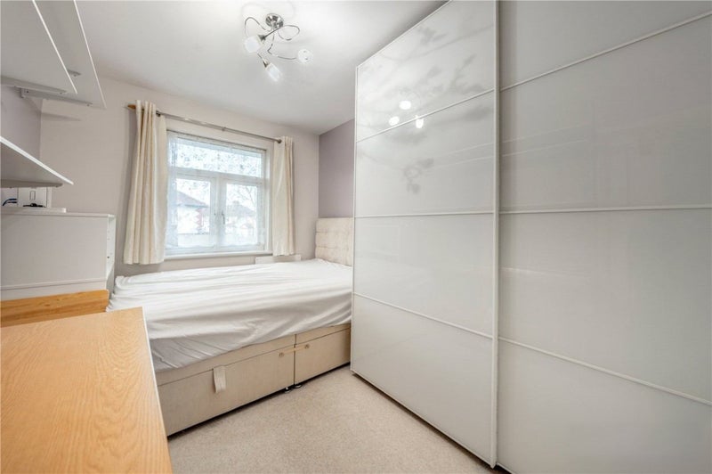 Photo 1: Room features double bed, desk and large wardrobe