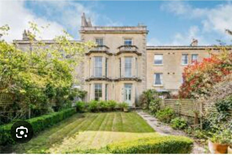 Photo 1: Front view of the villa