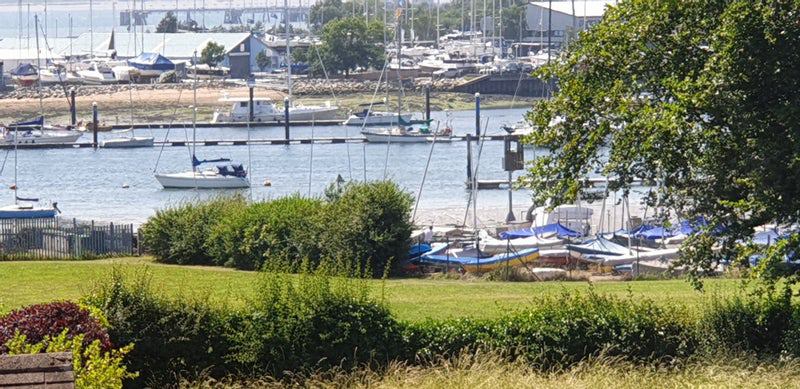 Photo 1: View across River Hamble, green space for ball games and picnics
