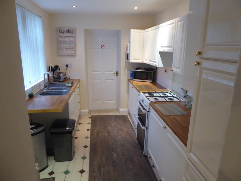 Photo 1: Communal Kitchen with utility room