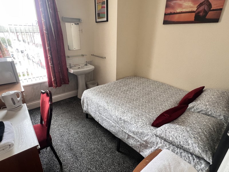 Photo 1: Room room with double bed.