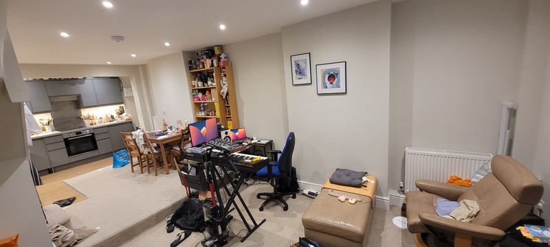 Photo 1: Living Dining - Angle 1 (The desk and PC setup seen not included, Said space will be open for own st