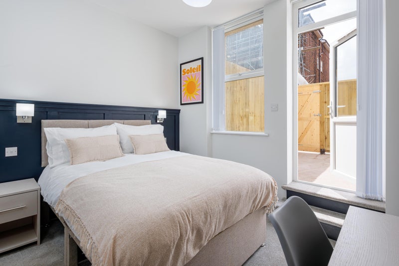 Photo 1: BEDROOM 1 - PRIVATE PATIO