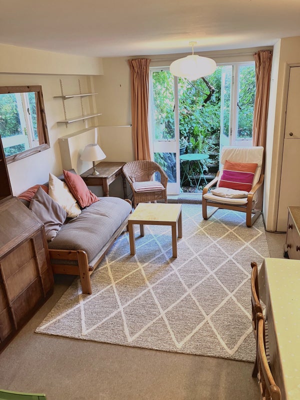 Photo 1: Living room with door to small garden patio 