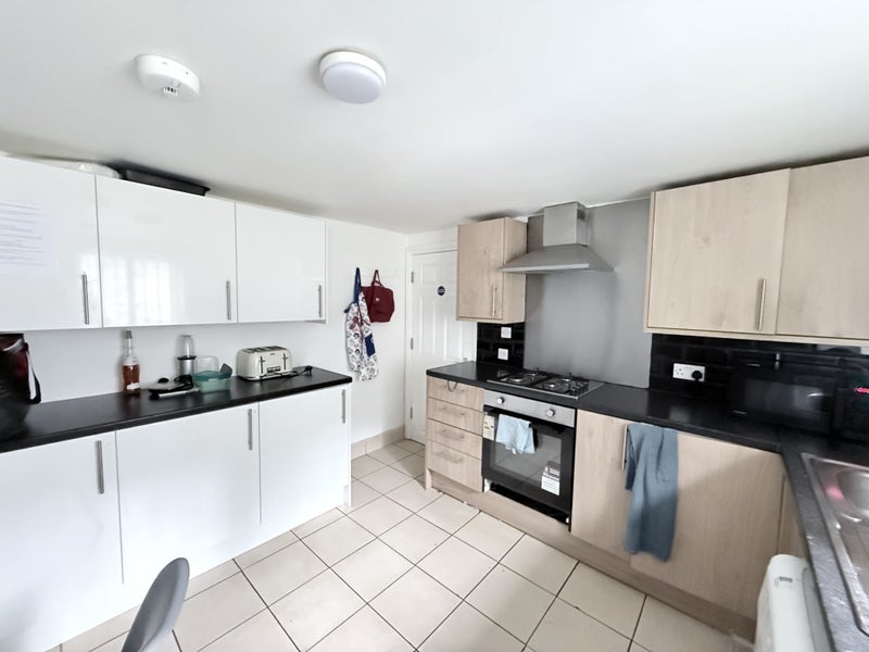 Photo 1: Basement Kitchen