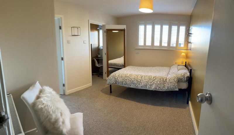 Photo 1: Furnished bedroom with feature shutters