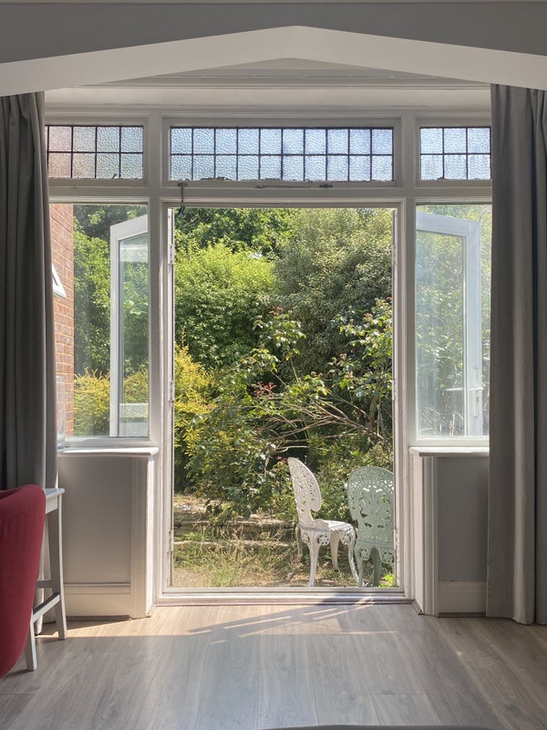 Photo 1: View of patio from bedroom