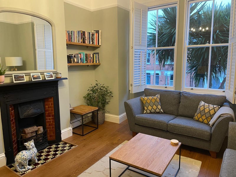 Photo 1: Living room with feature fire place 