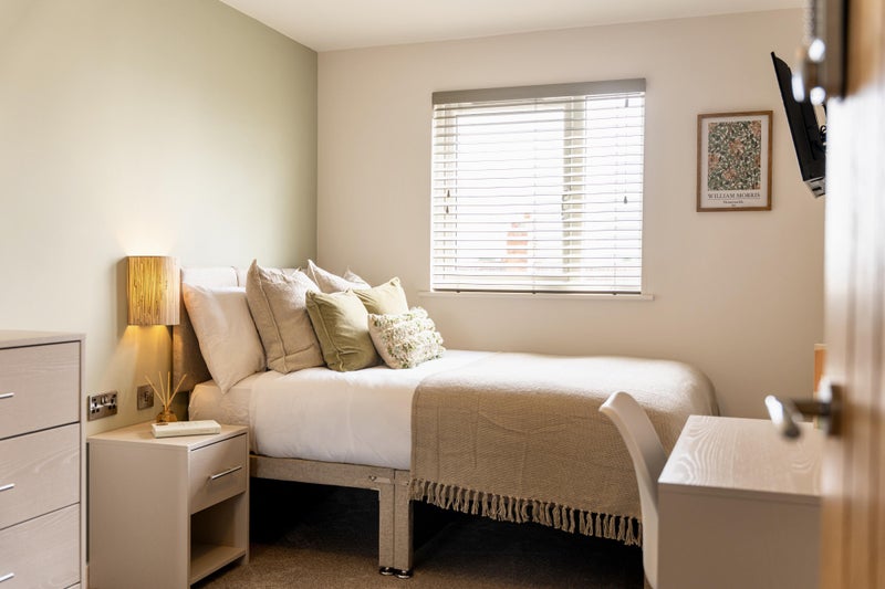 Photo 1: modern room with desk & TV