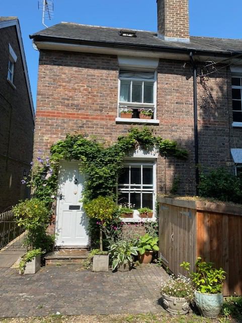 Photo 1: Front of house, with bicycle storage