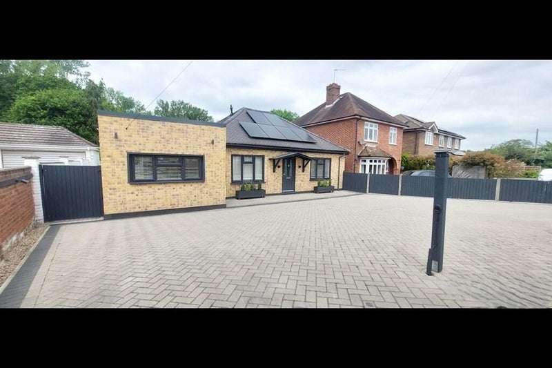 Photo 1: Front Entrance and Parking