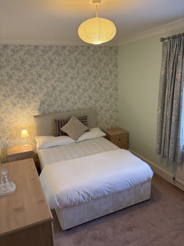 Photo 1: Bedroom, 2x side tables, large chest of draws and large wardrobe.