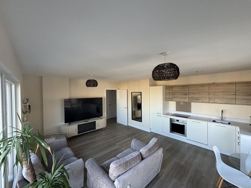 Photo 1: Living Room and Kitchen