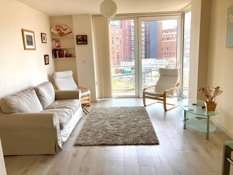 Photo 1: Living room with large balcony corner window/ door