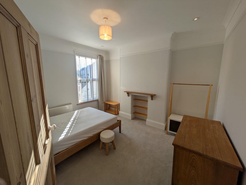 Photo 1: Example bedroom (currently available room is the same format but on the ground floor)