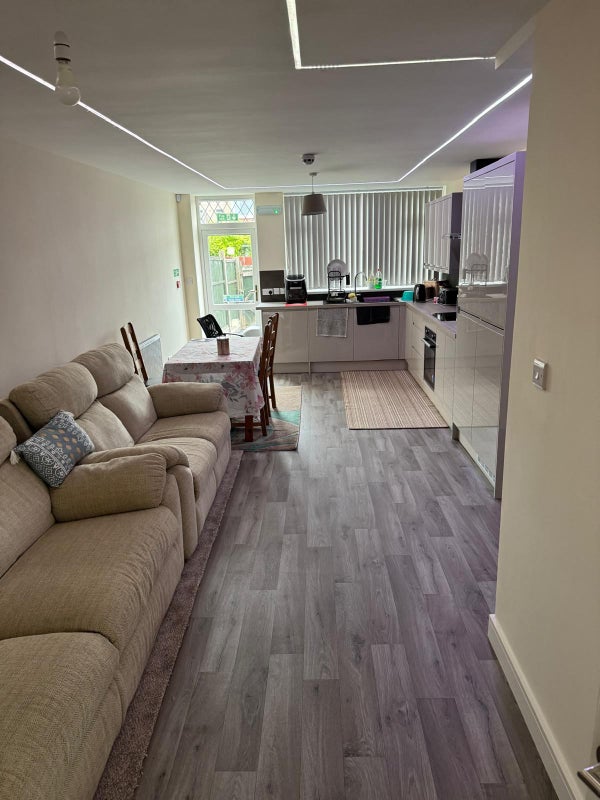 Photo 1: Communal lounge and kitchen