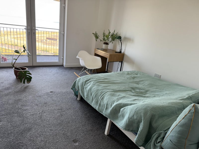 Photo 1: Bedroom with a private balcony