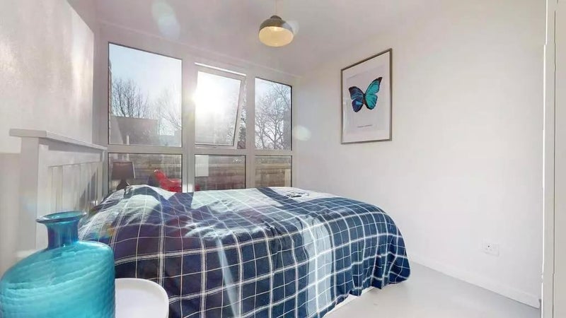 Photo 1: Bedroom 1 - with green views beyond