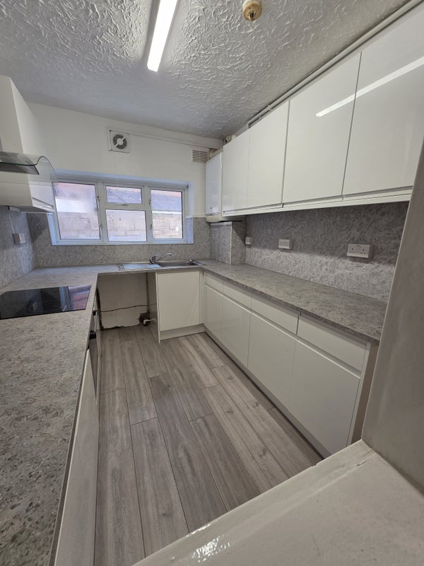 Photo 1: New kitchen with allocated cupboards