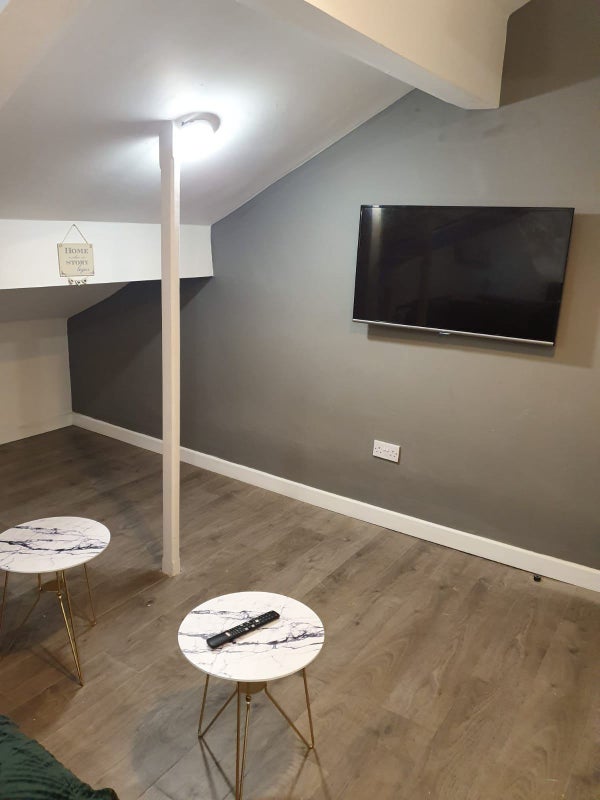 Photo 9: Wall Mounted TV