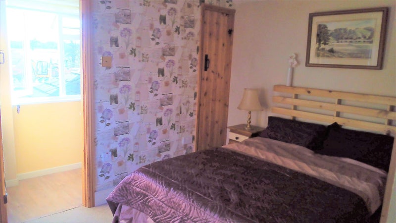 Photo 1: En suite bedroom, shower with garden view