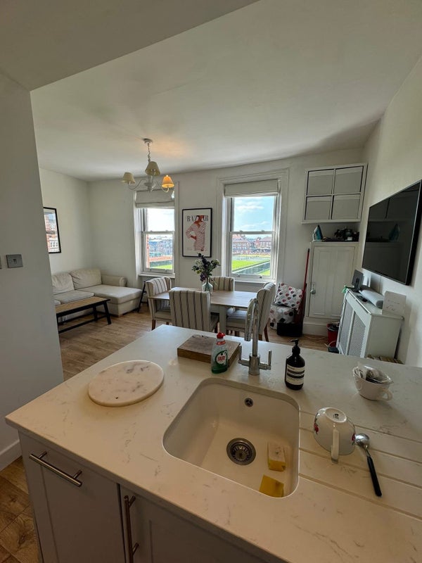 Photo 1: Kitchen and lounge area