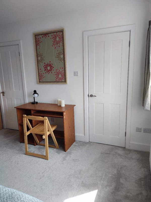 Photo 1: Desk and chair. En suite behind door to left, kitchenette behind door to right right