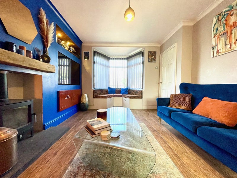 Photo 1: Quirky lounge with media wall 