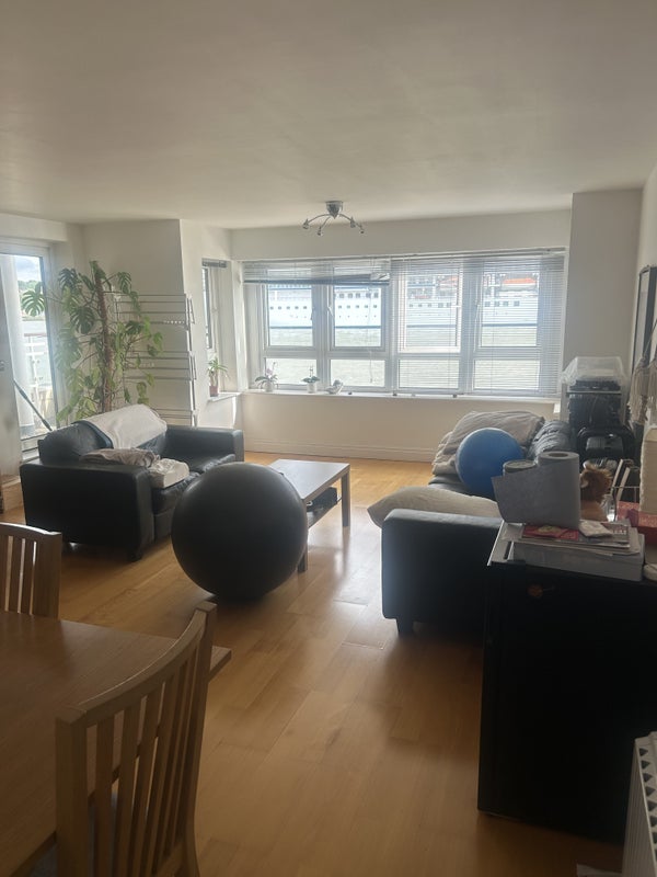 Photo 1: Shared living room/ dining room