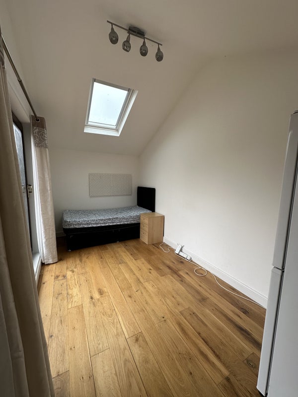Photo 1: Converted garage in to a room