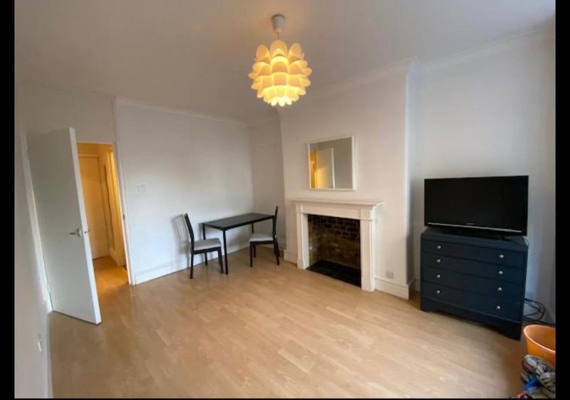 Photo 1: Living Room - comes furnished with couches and dining table