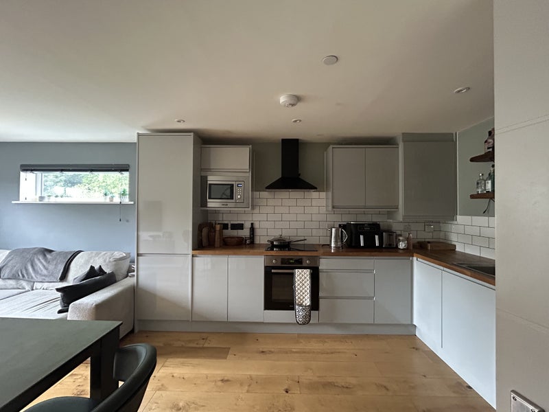 Photo 1: Fully stocked kitchen with plates, glasses, cookware etc.
