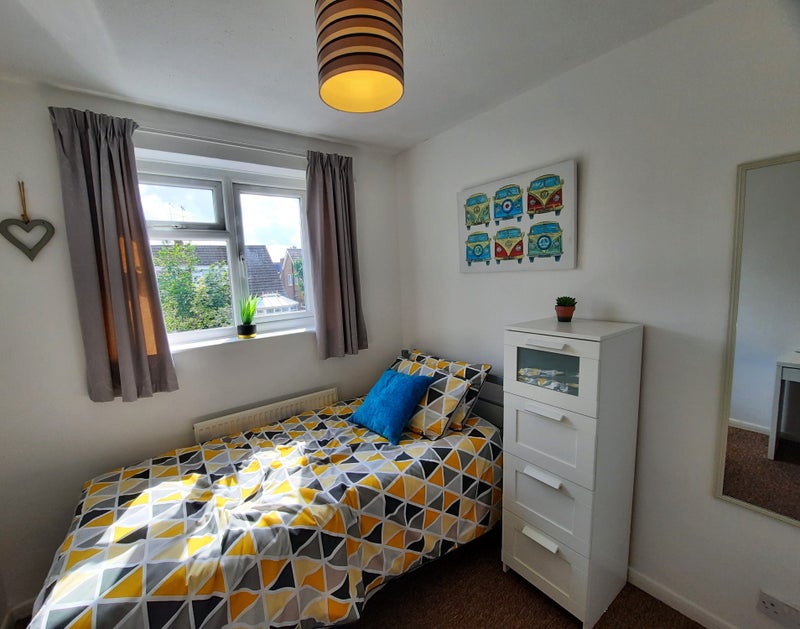 Photo 1: This light and airy room is in a quiet, residential area