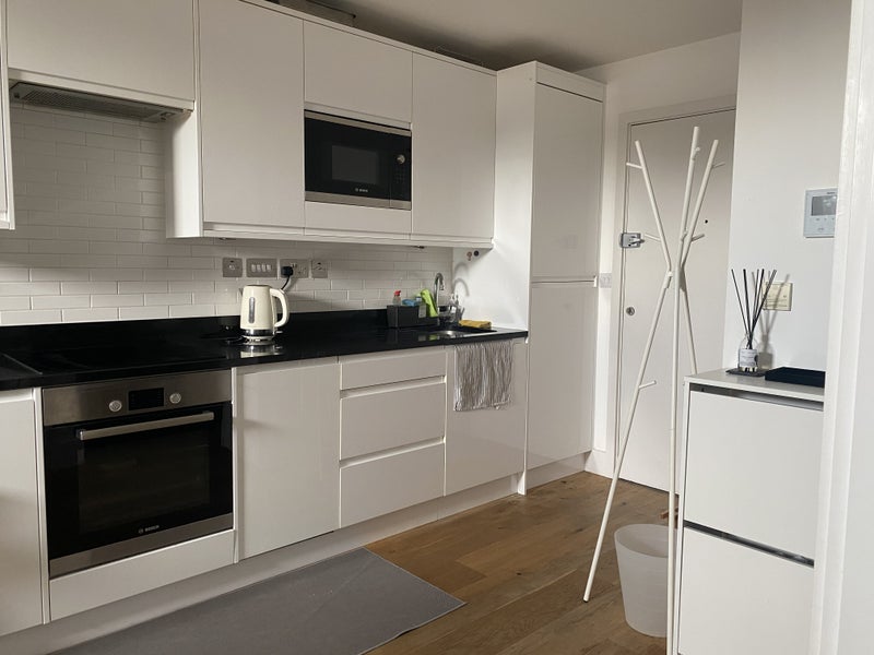 Photo 1: Open Kitchen and Entrance Door