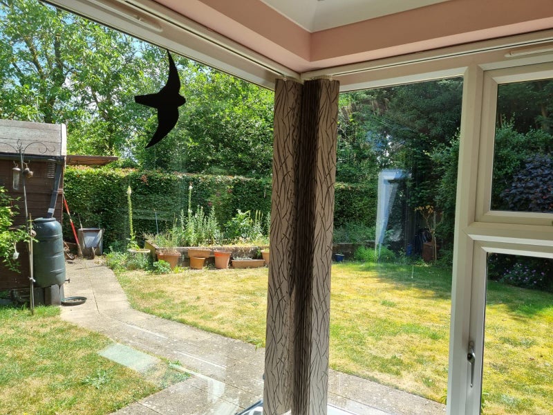 Photo 1: Large corner window overlooking garden