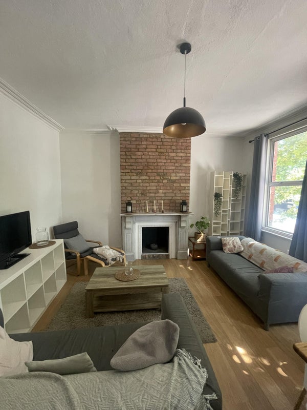 Photo 1: Spacious shared living room w/ TV