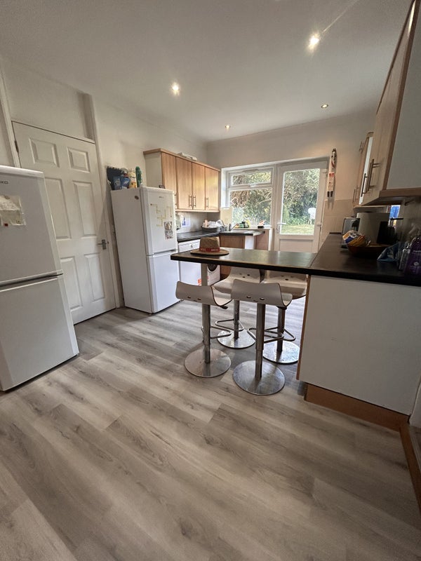 Photo 1: Kitchen with brand new flooring