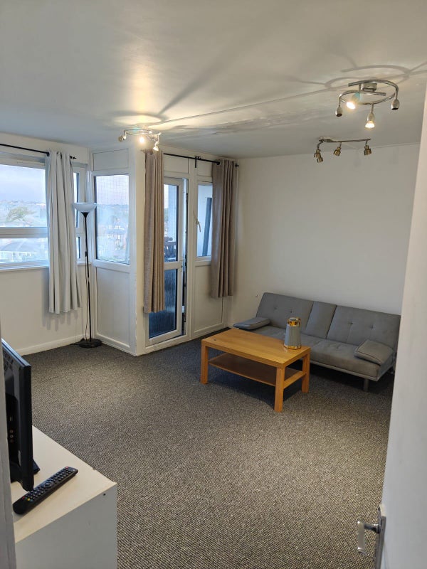 Photo 1: Lounge and access to balcony