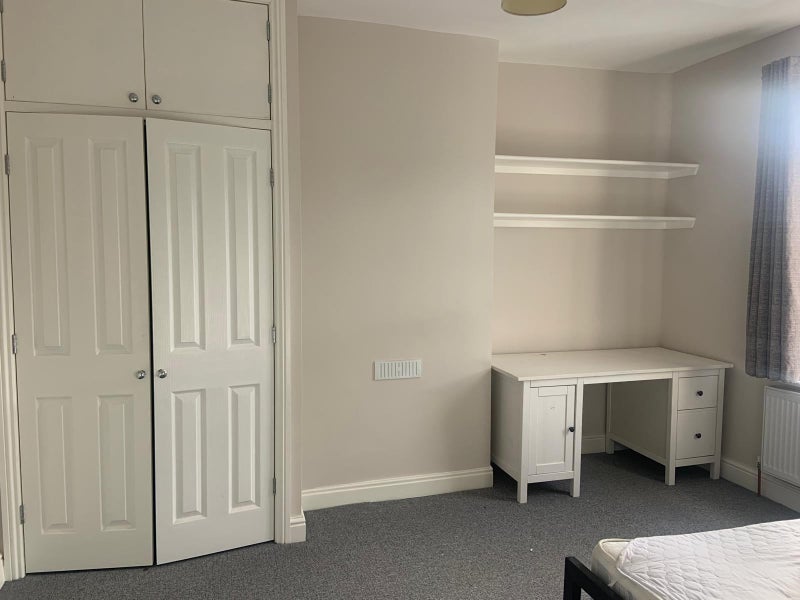 Photo 1: The available bedroom