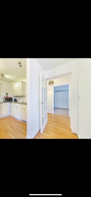 Photo 1: Hallway and kitchen