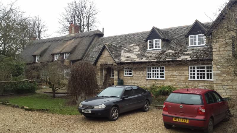 Photo 1: Rear of property and parking area